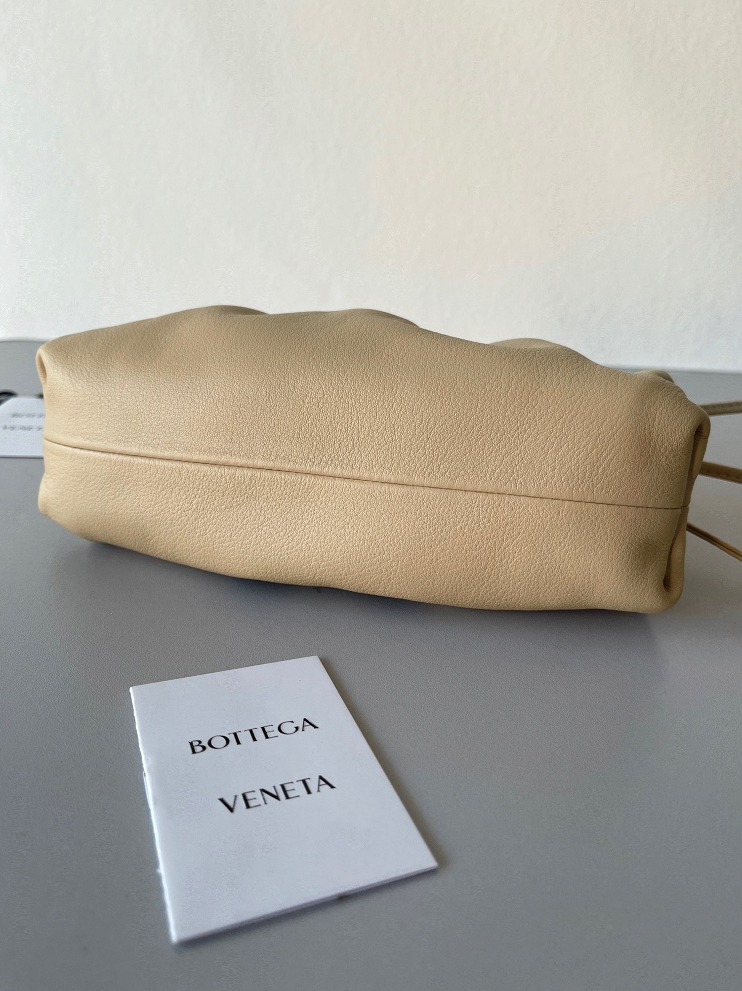 Fake B0tt*ga Ven*ta Mini Pouch with Strap Almond