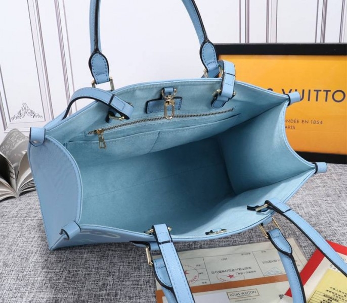 L0vis Vvtt0n Monogram Empreinte Leather Onthego MM Bag In Summer Blue