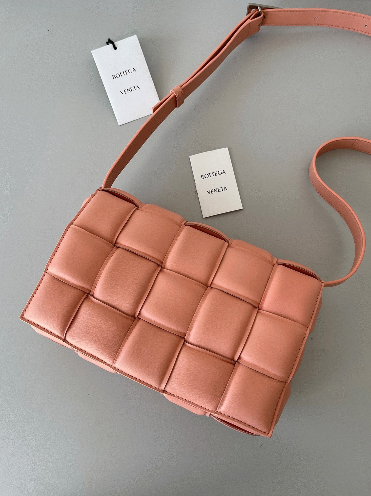 Top Quality Fake B0tt*ga Ven*ta Padded Cassette Bag In Peachy