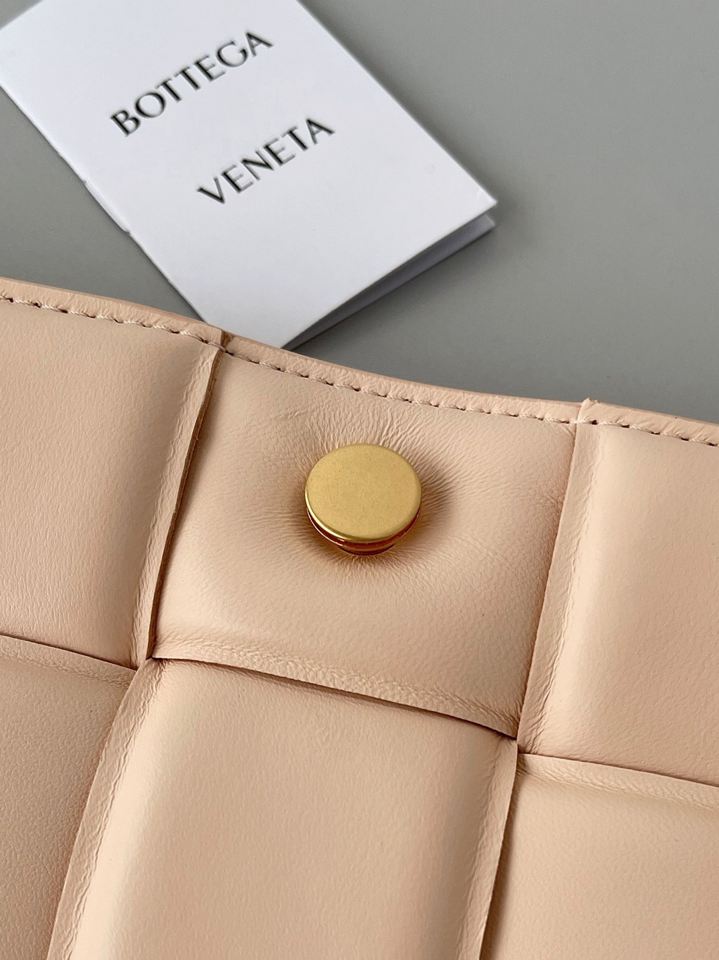 Top Quality Fake B0tt*ga Ven*ta Padded Cassette Bag In Melon