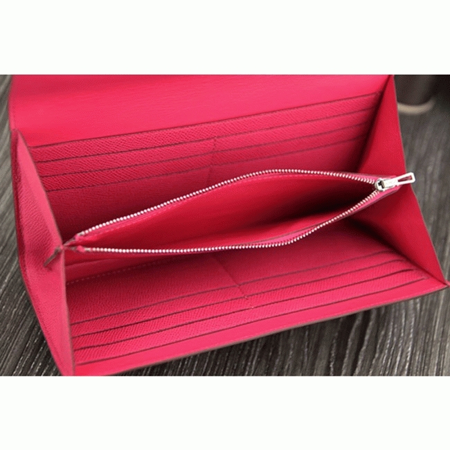 Peach knockoff H**me5 Constance wallet
