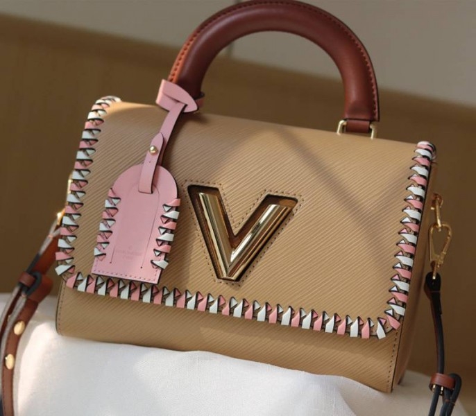 L0vis Vvtt0n Epi Leather Twist MM Bag In Beige With Braided Edges Flap