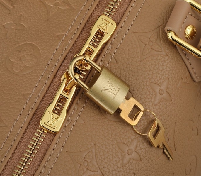 L0vis Vvtt0n Monogram Empreinte Speedy Soft 30 Handbag In Apricot